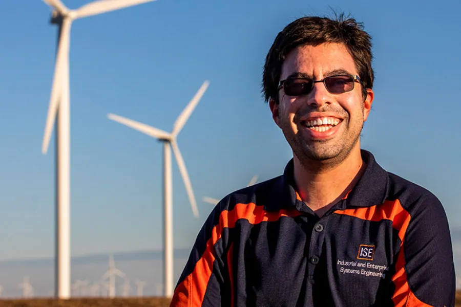 Graduate student Lucas Buccafusca looks for ways to improve the efficiency of wind farms. He had a key insight on a foggy day near a wind farm in central Illinois. 