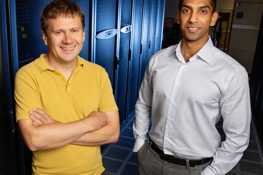 Physics professor Aleksei Aksimentiev, left, and graduate student Manish Shankla. 