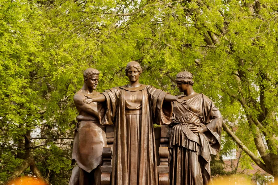 Alma Mater statue in springtime.