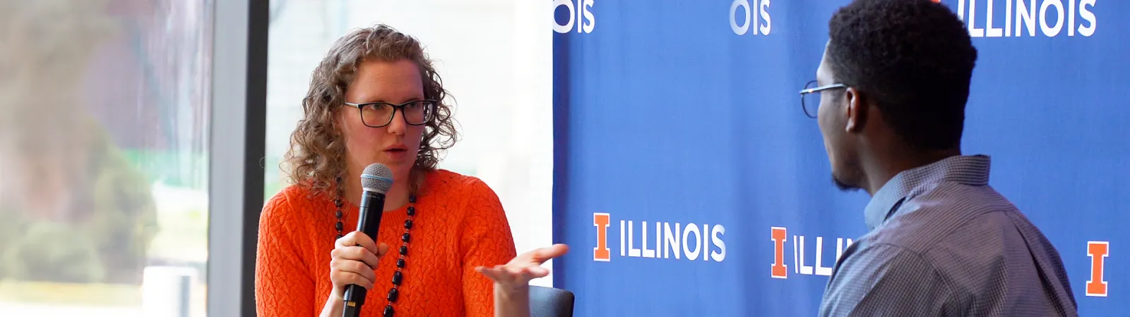 A Research Live! contestant being interviewed on stage