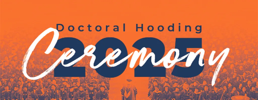 speaker and audience in State Farm Center with Doctoral Hooding Ceremony 2025 in decorative lettering